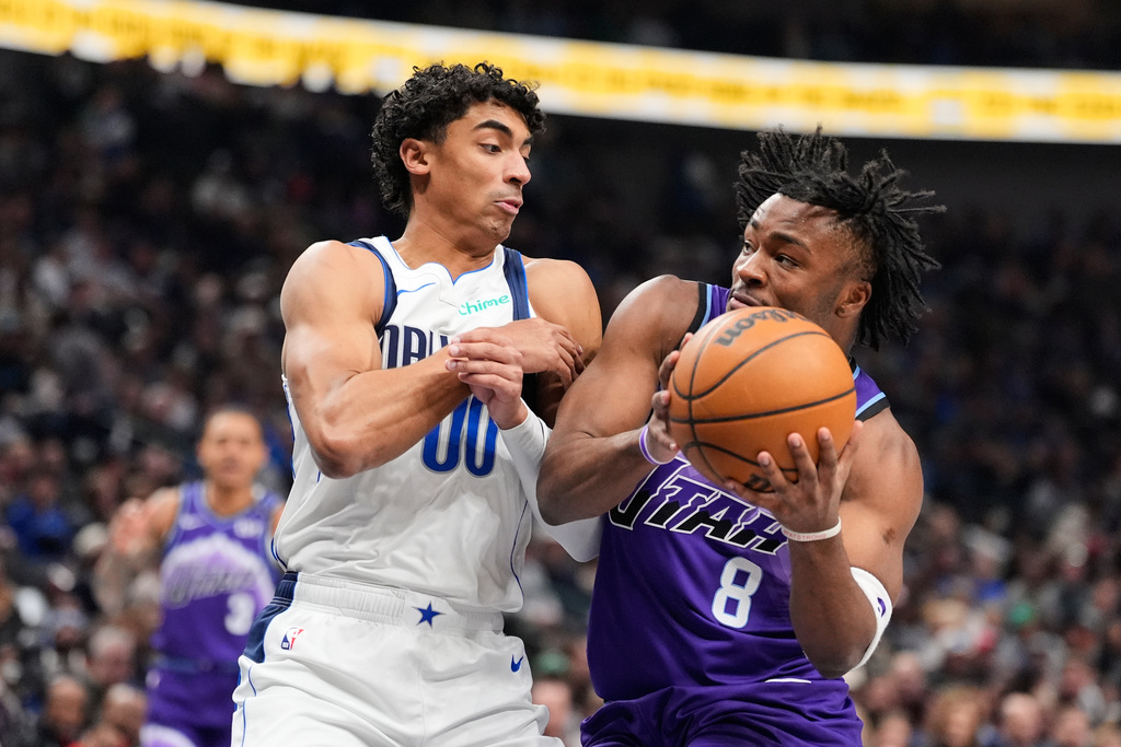 Utah Jazz guard Isaiah Collier (8) drives to the basket against Dallas Mavericks guard Max Christie (00) in the first half of an NBA basketball game in Dallas, Saturday, Jan. 17, 2026. (AP Photo/Tony Gutierrez)
