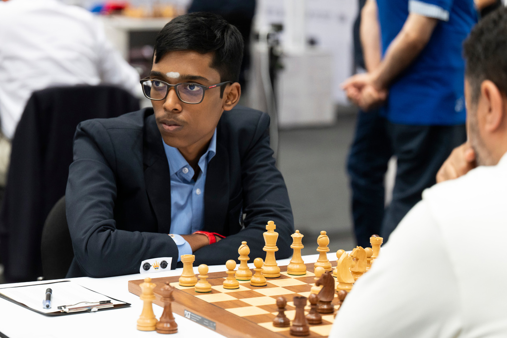 FILE - Rameshbabu Praggnanandhaa, of India, left, focuses during his game with Tissir Mohamed, of Morocco, at the 45th Chess Olympiad in Budapest, Hungary, on Sept. 11, 2024. (AP Photo/Denes Erdos)
