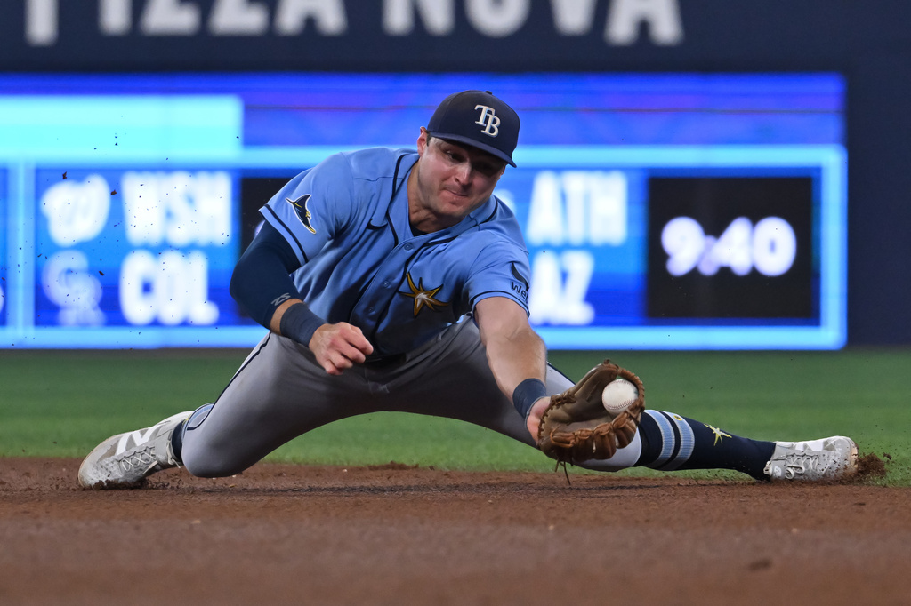Tampa Bay Rays second baseman Ben Williamson catches a line drive off the bat of Toronto Blue Jays' Daulton Varsho for the out during the fourth inning of a baseball game in Toronto on Tuesday, July 21, 2026. (Jon Blacker/The Canadian Press via AP)