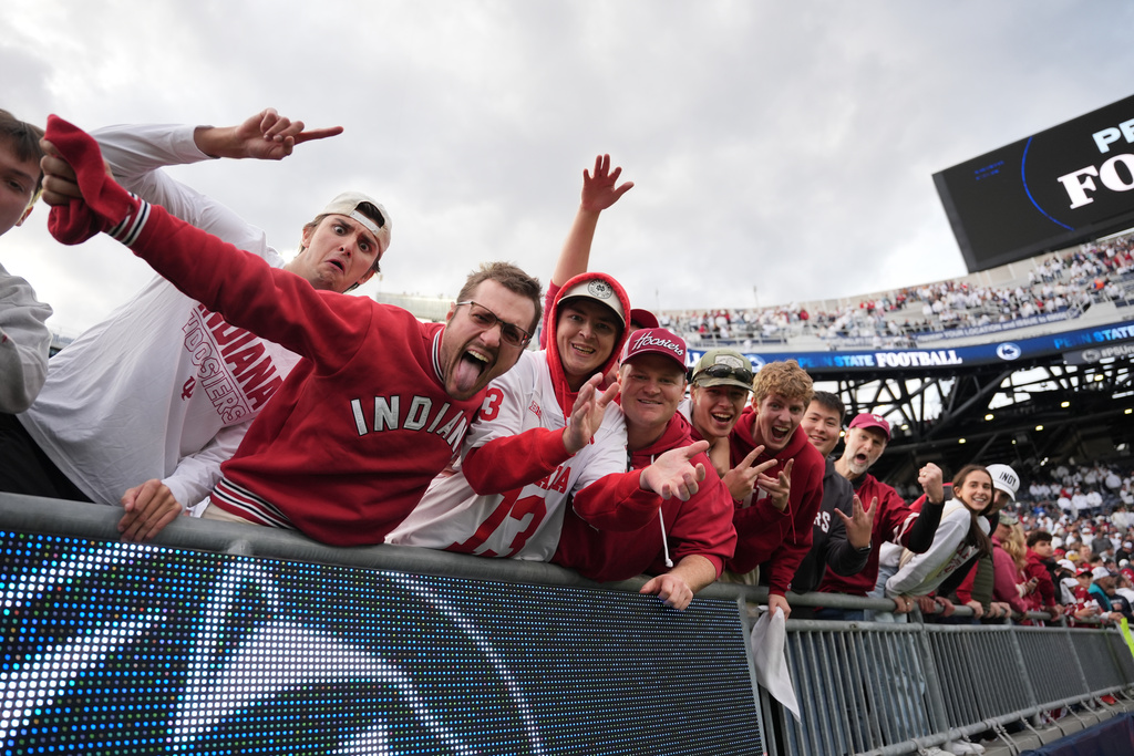Indiana fans celebrate following an NCAA college football game against Penn State, Saturday, Nov. 8, 2025, in State College, Pa. (AP Photo/Sam Balkansky)