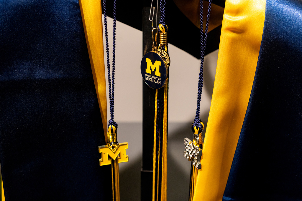 Graduation apparel is seen on display at a store at the Michigan Union on the University of Michigan campus in Ann Arbor, Mich., Jan. 17, 2026. (AP Photo/Emily Elconin)