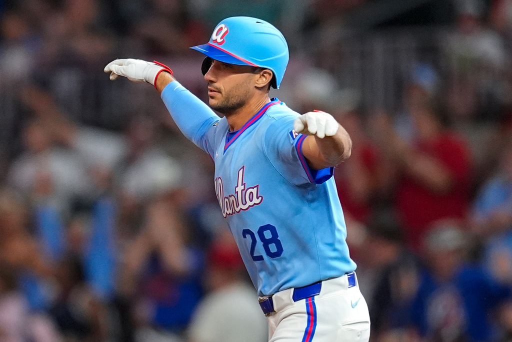 Atlanta Braves' Matt Olson (28) celebrates a two-run homer in the sixth inning of a baseball game against the Cleveland Guardians, Friday, April 10, 2026, in Atlanta. (AP Photo/Mike Stewart)