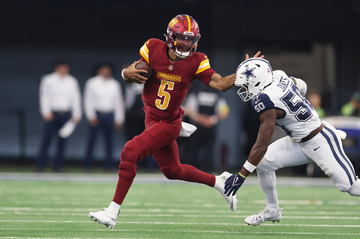 Washington Commanders quarterback Jayden Daniels, left, runs with the ball as Dallas Cowboys linebacker Shemar James tries to stop him during the first half of an NFL football game Sunday, Oct. 19, 2025, in Arlington, Texas. (AP Photo/Gareth Patterson) Washington Commanders quarterback Jayden Daniels, left, runs with the ball as Dallas Cowboys linebacker Shemar James tries to stop him during the first half of an NFL football game Sunday, Oct. 19, 2025, in Arlington, Texas. (AP Photo/Gareth Patterson)