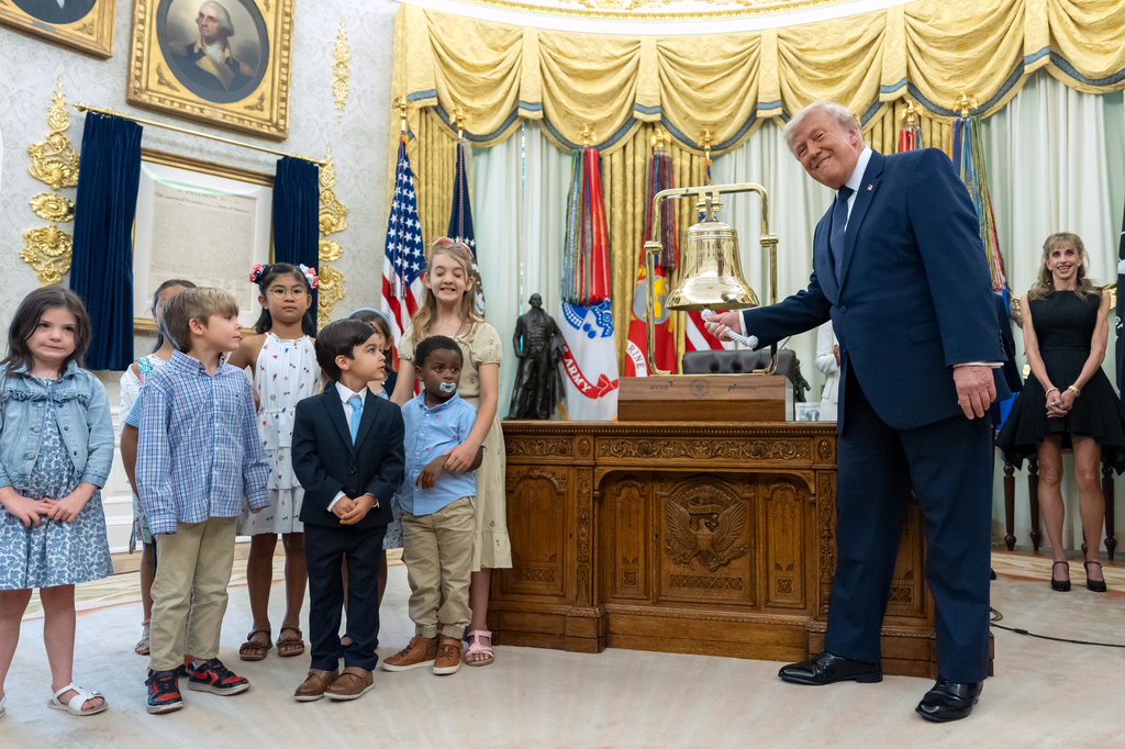 President Donald Trump rings the opening bell for the New York Stock Exchange and the Nasdaq in the Oval Office at the White House, Monday, July 6, 2026, in Washington. (AP Photo/Mark Schiefelbein)