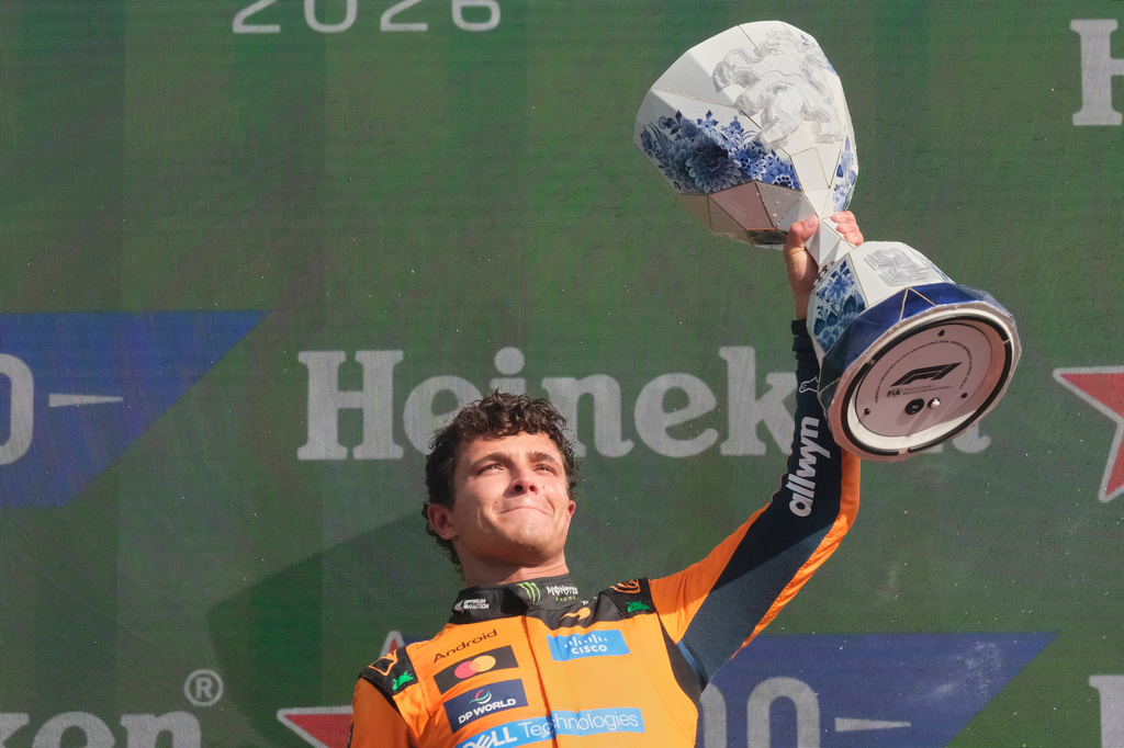 McLaren driver Lando Norris of Britain holds the trophy after winning the Formula One Dutch Grand Prix in Zandvoort , Netherlands, Sunday, Aug. 23, 2026. (AP Photo/Patrick Post)