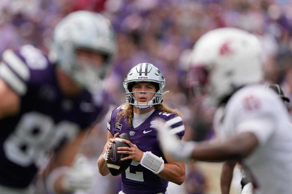 Kansas State quarterback Avery Johnson looks to pass during the first half of an NCAA college football game against Washington State, Saturday, Sept. 12, 2026, in Manhattan, Kan. (AP Photo/Charlie Riedel)