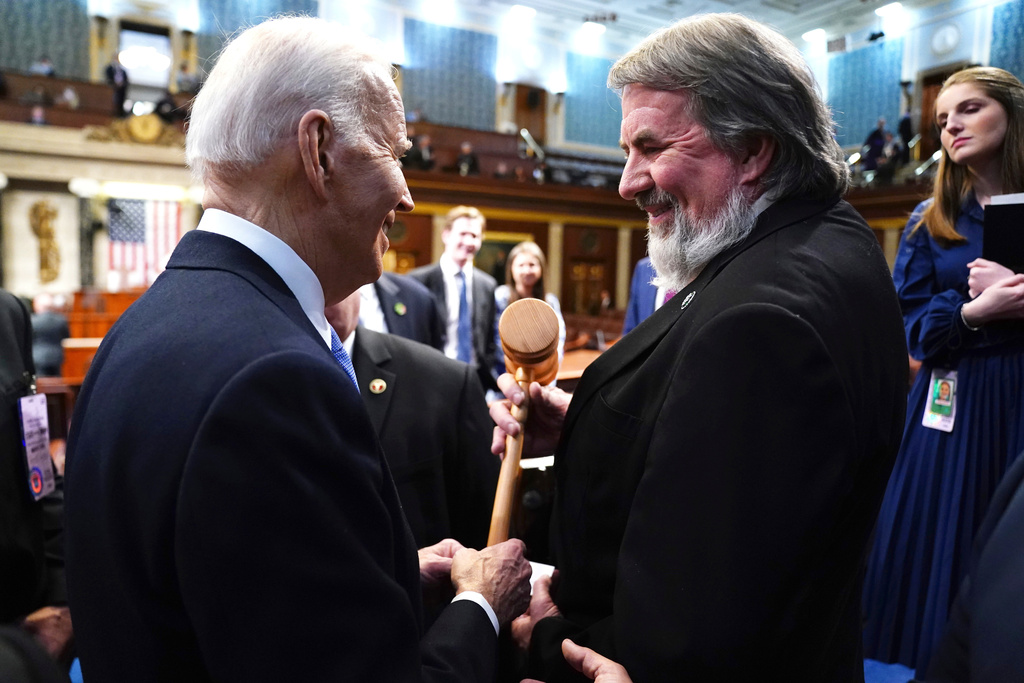 FILE - President Joe Biden, left, greets Rep. Doug LaMalfa, R-Calif., after delivering the State of the Union address to a joint session of Congress at the Capitol, March 7, 2024, in Washington. (Shawn Thew/Pool via AP, FIle)