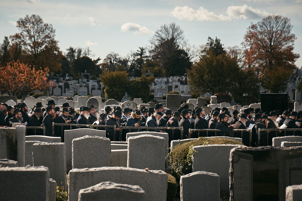 Chabad-Lubavitch rabbis gather in prayer at the resting place of the Rebbe, Rabbi Menachem M. Schneerson, one of Judaism’s most influential figures, in the Queens borough of New York on Friday, Nov. 14, 2025, during the International Conference of Chabad-Lubavitch Emissaries. (AP Photo/Andres Kudacki)