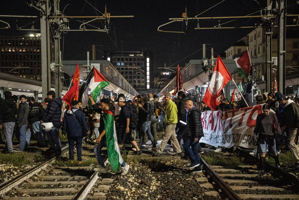 Pro-Palestinian protesters demonstrate at Cadorna train station in solidarity with the Global Sumud Flotilla on Wednesday, Oct. 1, 2025, in Milan, Italy, after ships were intercepted by the Israeli navy. (Marco Ottico/LaPresse via AP)
