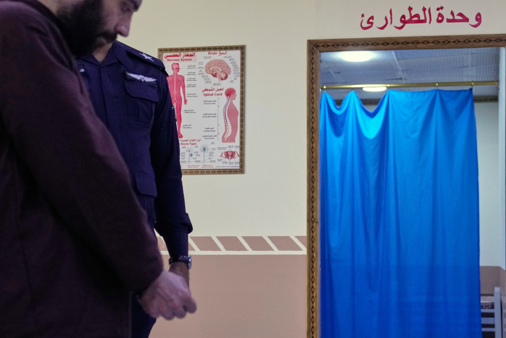 A suspected Islamic State militant who was transferred from Syria to Iraq, arrives for medical examination, in Al-Karkh Central Prison in Baghdad, Iraq, Thursday, Feb. 12, 2026. (AP Photo/Hadi Mizban)