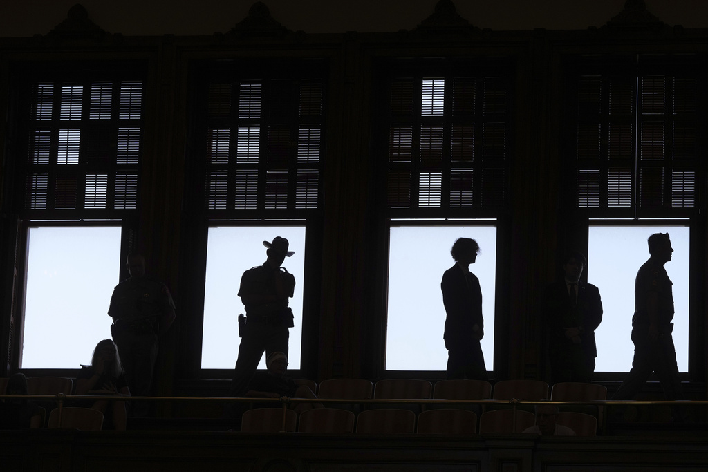 Texas troopers watch from the balcony as lawmakers debate a redrawn U.S. congressional map in Texas during a special session, Wednesday, Aug. 20, 2025, in Austin, Texas. (AP Photo/Eric Gay)