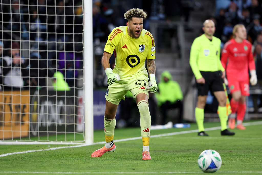 Minnesota United goalkeeper Dayne St. Clair celebrates after making a save against the Seattle Sounders during a penalty shootout of Game 3 in the first round of MLS soccer's Western Conference playoffs in St. Paul, Minn., Saturday, Nov. 8, 2025. (AP Photo/Ellen Schmidt)
