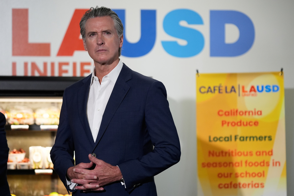 Gov. Gavin Newsom prepares to speak at a news conference at Belvedere Middle School, Wednesday, Oct. 8, 2025, in Los Angeles. (AP Photo/Damian Dovarganes)