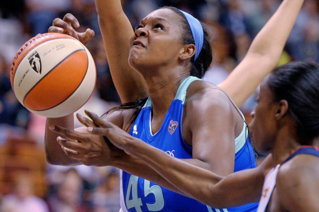 FILE - New York Liberty's Kara Braxton is fouled by Connecticut Sun's Kalana Greene during a WNBA exhibition basketball game, May 7, 2012, in Uncasville, Conn. (Sean D. Elliot/The Day via AP)