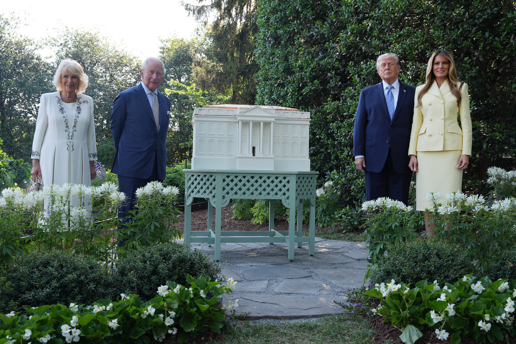 President Donald Trump and first lady Melania Trump stand for a photo with Britain's King Charles III and Queen Camilla at the White House bee hive on the South Lawn of the White House, Monday, April 27, 2026, in Washington. (AP Photo/Alex Brandon, Pool)