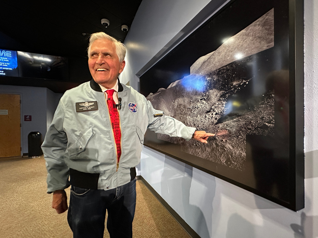Apollo astronaut Harrison "Jack" Schmitt points to a crater where he collected samples during his 1972 moon mission, while being interviewed at the New Mexico Museum of Natural History and Science in Albuquerque, N.M., on April 22, 2026. (AP Photo/Susan Montoya Bryan)