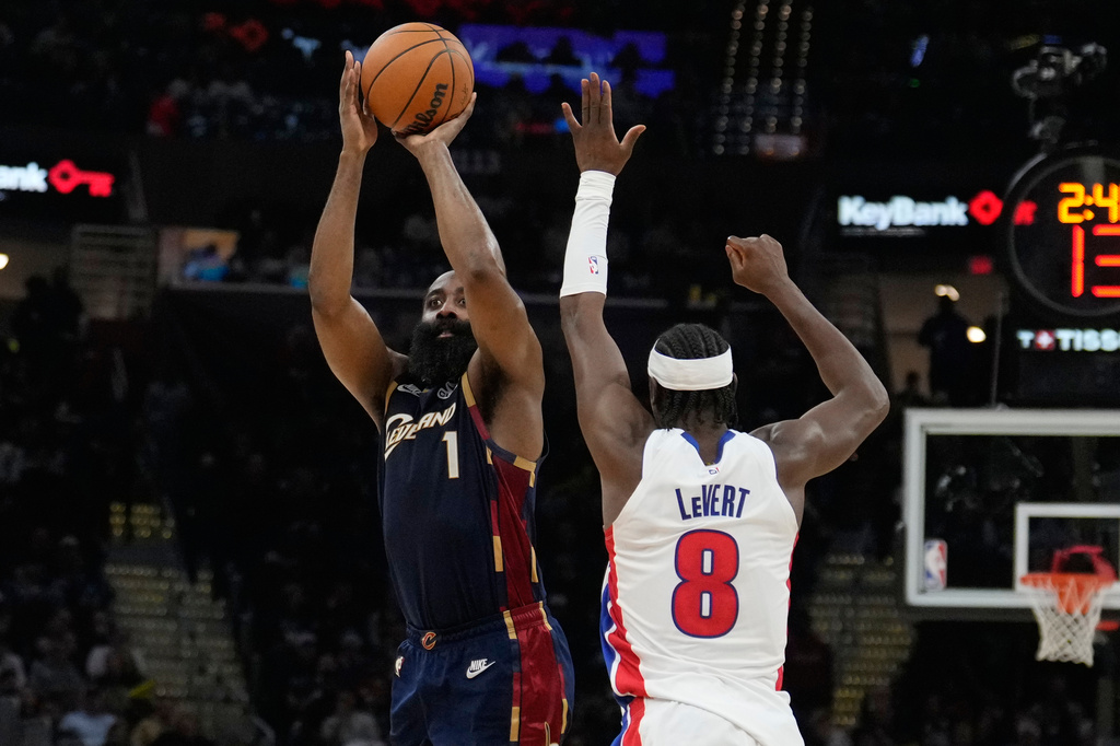 Cleveland Cavaliers' James Harden (1) shoots as Detroit Pistons' Caris LeVert (8) defends in the second half of Game 6 of a second-round NBA basketball playoffs series Friday, May 15, 2026, in Cleveland. (AP Photo/Sue Ogrocki)
