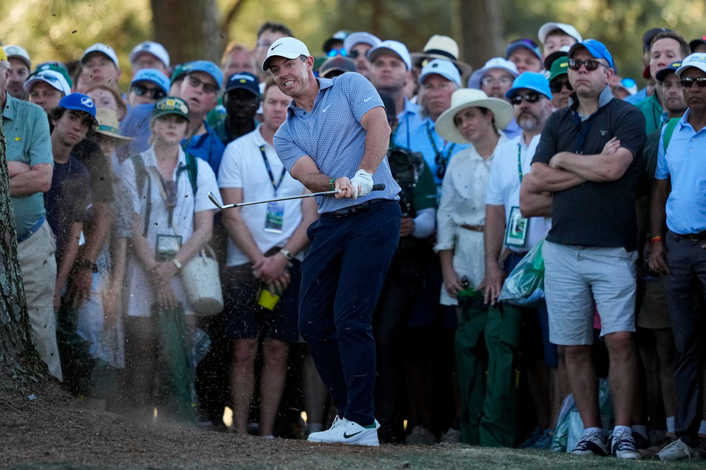 Rory McIlroy, of Northern Ireland, hits from the pine straw on the 17th hole during the third round of the Masters golf tournament at the Augusta National Golf Club, Saturday, April 11, 2026, in Augusta, Ga. (AP Photo/Gerald Herbert)