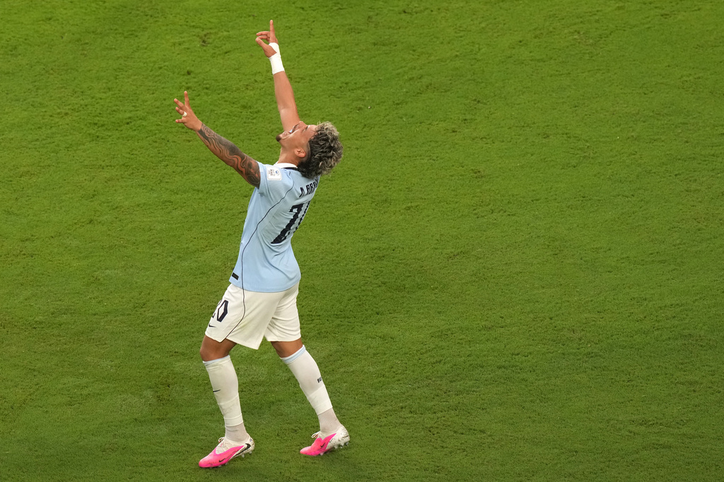 Uruguay's Maxi Araujo (20) celebrates after scoring their opening goal during the World Cup Group H soccer match between Saudi Arabia and Uruguay in Miami Gardens, Fla., Monday, June 15, 2026. (AP Photo/Marta Lavandier)