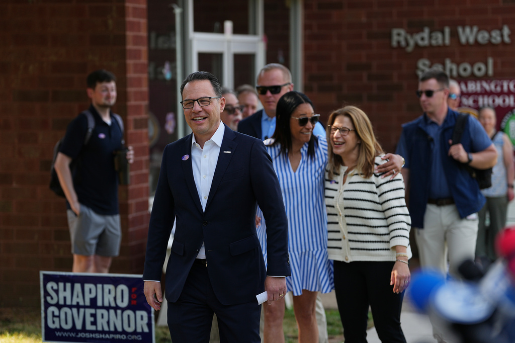 Pennsylvania Gov. Josh Shapiro walk to speaks with members of the media outside his polling place in Rydal, Pa., Tuesday, May 19, 2026. (AP Photo/Matt Rourke)