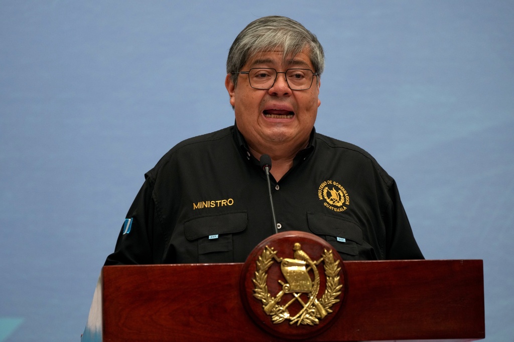Guatemalan Interior Minister Francisco Jimenez gives a press conference at the National Palace in Guatemala City, Monday, Oct. 13, 2025, after authorities confirmed the escape of 20 members from the Barrio 18 gang from a maximum security prison. (AP Photo/Moises Castillo)