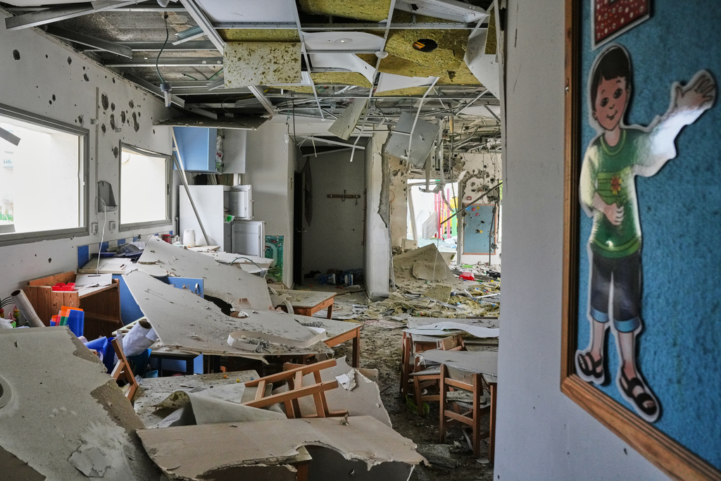 View of a kindergarten hit by fragments of an Iranian missile in Rishon LeZion, Israel, Saturday, March 21, 2026. (AP Photo/Maya Levin)