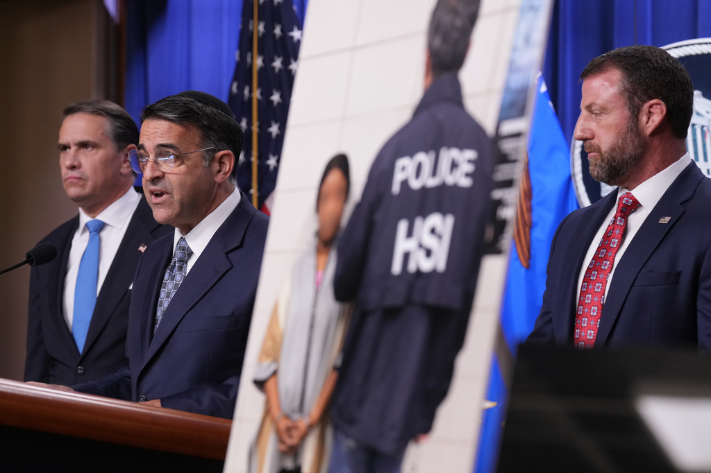 Daniel Rosen, U.S. Attorney for the District of Minnesota, speaks during a news conference at the Department of Justice, Wednesday Sept. 30, 2026, in Washington, as Attorney General Todd Blanche, left, and Secretary of Homeland Security Markwayne Mullin, look on. (AP Photo/Jacquelyn Martin)