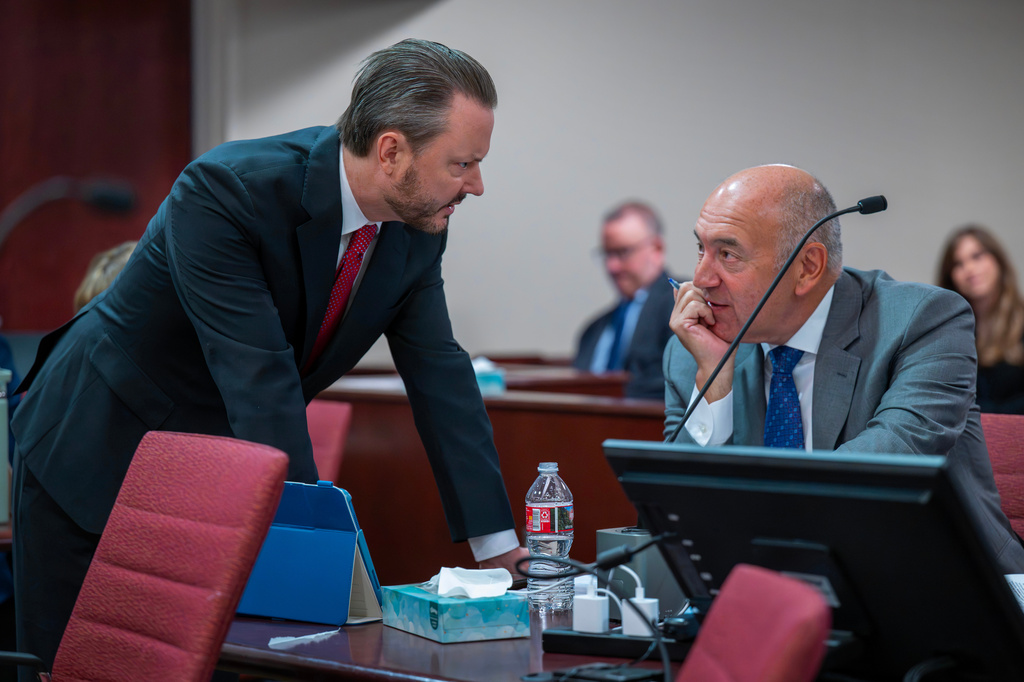 Attorney Kevin Huff, left, representing Meta Platform Inc., and attorney Donald Miglior, for the state, talk at the start of phase 2 of the trial against the social media company, in Santa Fe, N.M., Monday, May 4, 2026. (Eddie Moore/The Albuquerque Journal via AP, Pool)