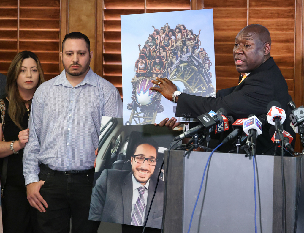 Attorney Benjamin Crump displays a photo of the Epic Universe roller coaster during a press conference with the family of Kevin Zavala in downtown Orlando, Fla., Wednesday, Sept. 24, 2025. (Joe Burbank/Orlando Sentinel via AP)
