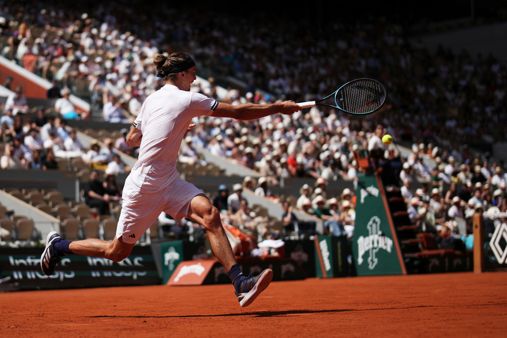 Alexander Zverev of Germany returns to Benjamin Bonzi of France during their first round men's singles tennis match at the French Open tennis tournament in Paris, Sunday, May 24, 2026. (AP Photo/Christophe Ena)