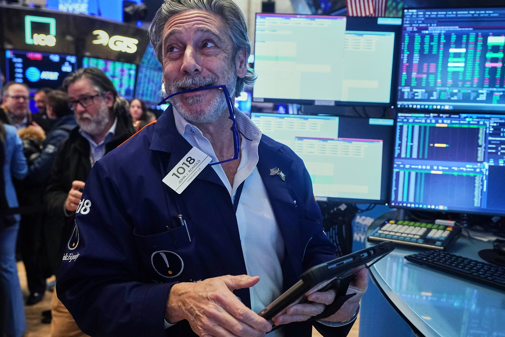 Trader John Romolo works on the floor of the New York Stock Exchange, Wednesday, Feb. 11, 2026. (AP Photo/Richard Drew)