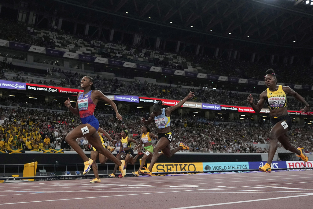 United States' Melissa Jefferson-Wooden wins the women's 100 meters final at the World Athletics Championships in Tokyo, Sunday, Sept. 14, 2025. (AP Photo/David J. Phillip)
