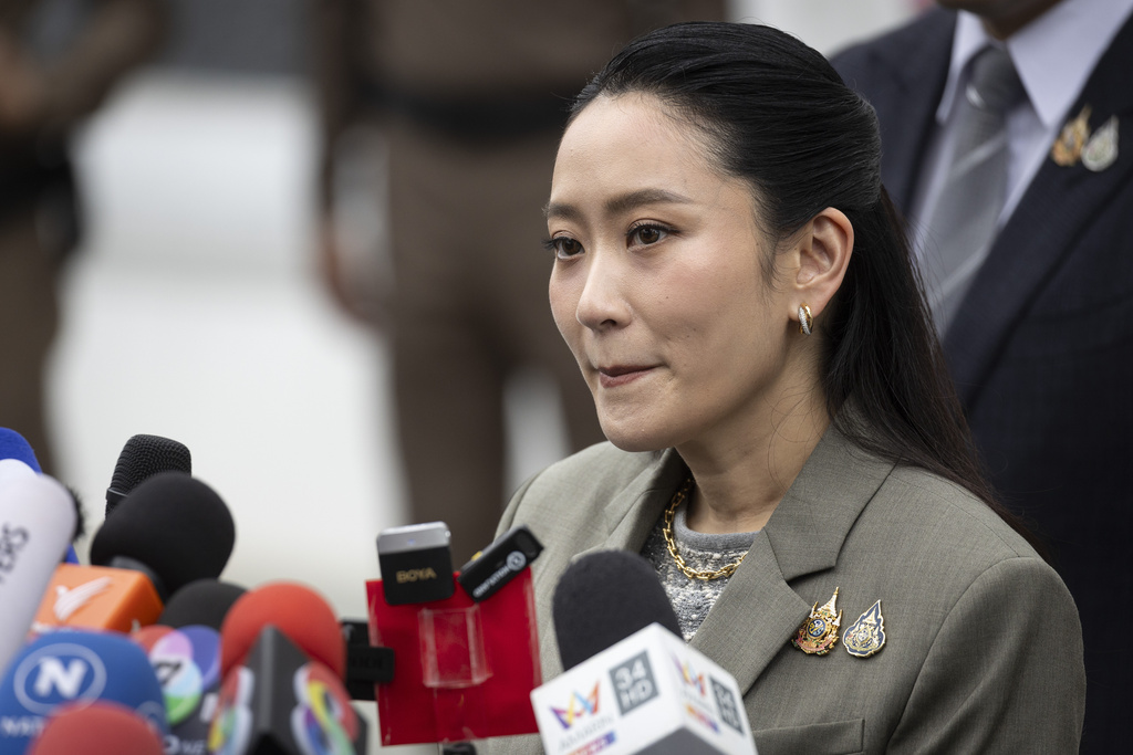 Former Prime Minister Paetongtarn Shinawatra, daughter of former Prime Minister Thaksin Shinawatra talks to reporters at the Supreme Court in Bangkok, Thailand, Tuesday, Sept. 9, 2025. (AP Photo/Wason Wanichakorn)