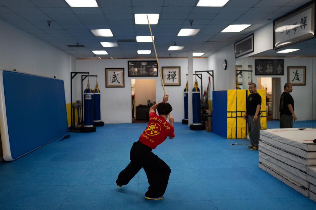 Austin Bouman practices Kung Fu in a studio in Arcadia, Calif., Tuesday, May 12, 2026, in the city whose former mayor, Eileen Wang, pleaded guilty to being an illegal agent of the Chinese government. (AP Photo/Jae C. Hong)