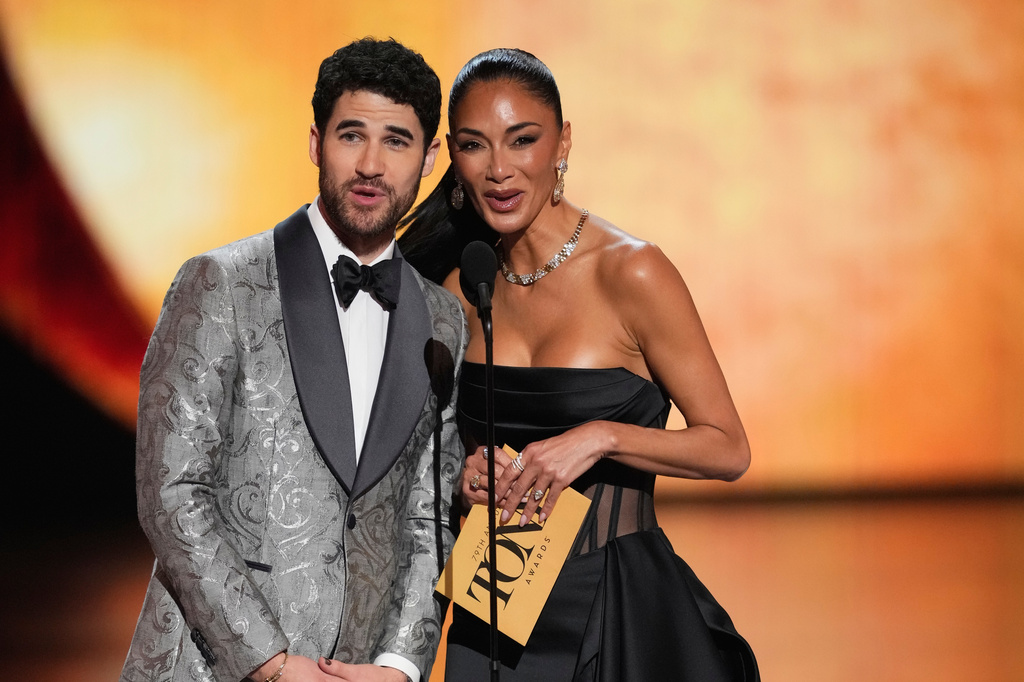 Darren Criss, left, and Nicole Scherzinger present the award for best performance by an actress in a leading role in a musical during the 79th Tony Awards on Sunday, June 7, 2026, at Radio City Music Hall in New York. (Photo by Charles Sykes/Invision/AP) ADDS NAMES OF PRESENTERS AND AWARD IN THE CAPTION