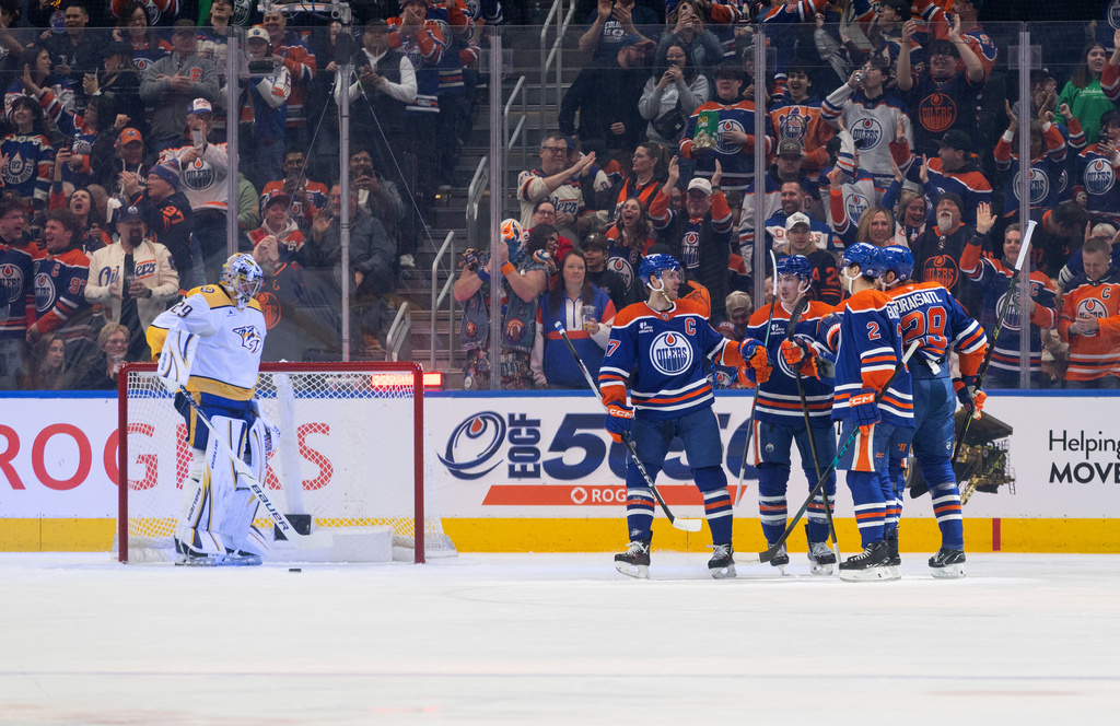 CORRECTS PERIOD TO FIRST NOT SECOND - Nashville Predators goalie Justus Annunen (29) looks on as the Edmonton Oilers celebrate a goal during the first period of an NHL hockey game in Edmonton, Alberta, Sunday, March 15, 2026. (Jason Franson/The Canadian Press via AP)