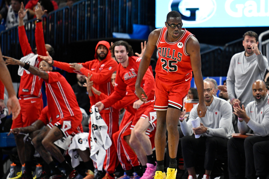 Chicago Bulls forward Jalen Smith (25) reacts after making a 3-pointer during the second half of an NBA basketball game against the Orlando Magic, Saturday, Oct. 25, 2025, in Orlando, Fla. (AP Photo/Phelan M. Ebenhack)