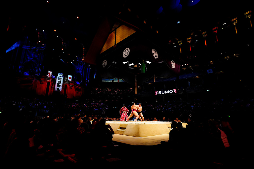 Shodai battles with Daieisho in the Makuuchi Division bout on day four of the Grand Sumo Tournament at the Royal Albert Hall in London, Saturday, Oct. 18, 2025. (Jordan Pettitt/PA via AP)