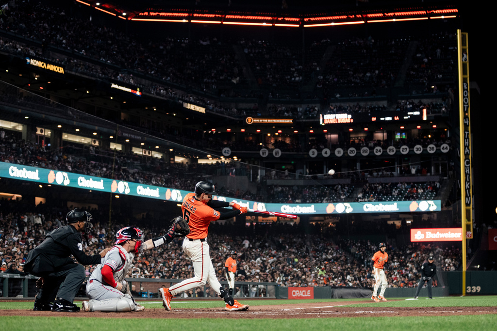 San Francisco Giants' Daniel Susac (6) hits a sacrifice fly during the seventh inning of a baseball game against the Los Angeles Angels in San Francisco, Friday, July 24, 2026. (Stephen Lam/San Francisco Chronicle via AP)
