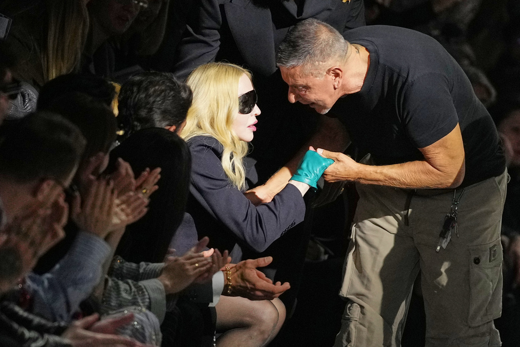 Madonna congratulates Stefano Gabbana at the end of the Dolce & Gabbana Fall/Winter 2026-2027 Women's collection, presented in Milan, Italy, Saturday, Feb. 28, 2026. (AP Photo/Antonio Calanni)