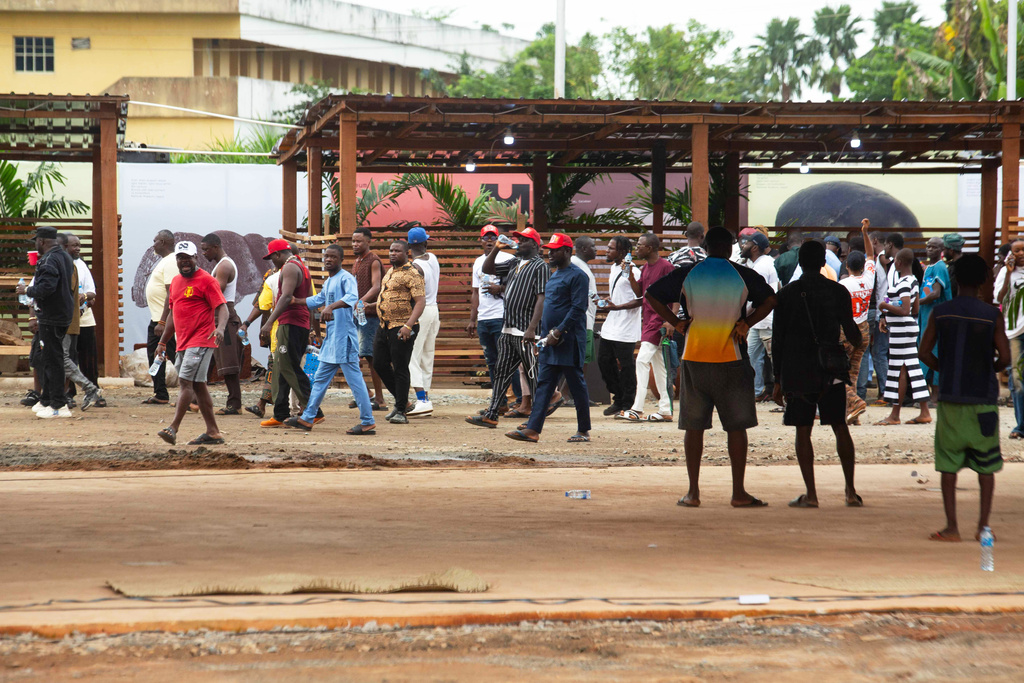 People protest during the launch of a new, state backed, Museum of West African Arts in Benin City, Nigeria, Sunday, Nov. 9, 2025. (AP Photo/Akpobasaha Oghenemaro Godspower )
