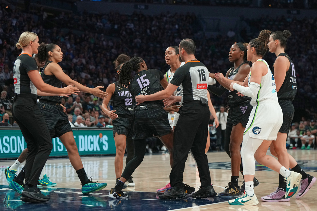Minnesota Lynx forward Napheesa Collier, center right, and Golden State Valkyries guard Tiffany Hayes (15) get into an altercation during the first half of a WNBA basketball game Monday, Aug. 24, 2026, in Minneapolis. (AP Photo/Abbie Parr)