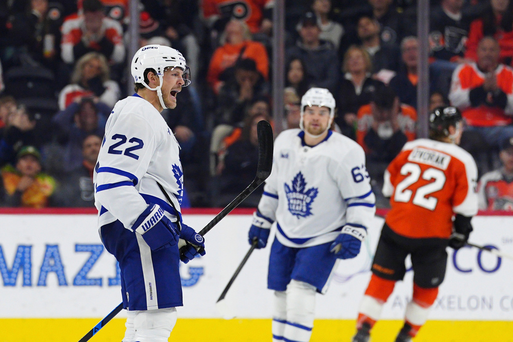 Toronto Maple Leafs' Jake McCabe, left, celebrates his goal during the second period of an NHL hockey game against the Philadelphia Flyers, Saturday, Nov. 1, 2025, in Philadelphia. (AP Photo/Derik Hamilton)