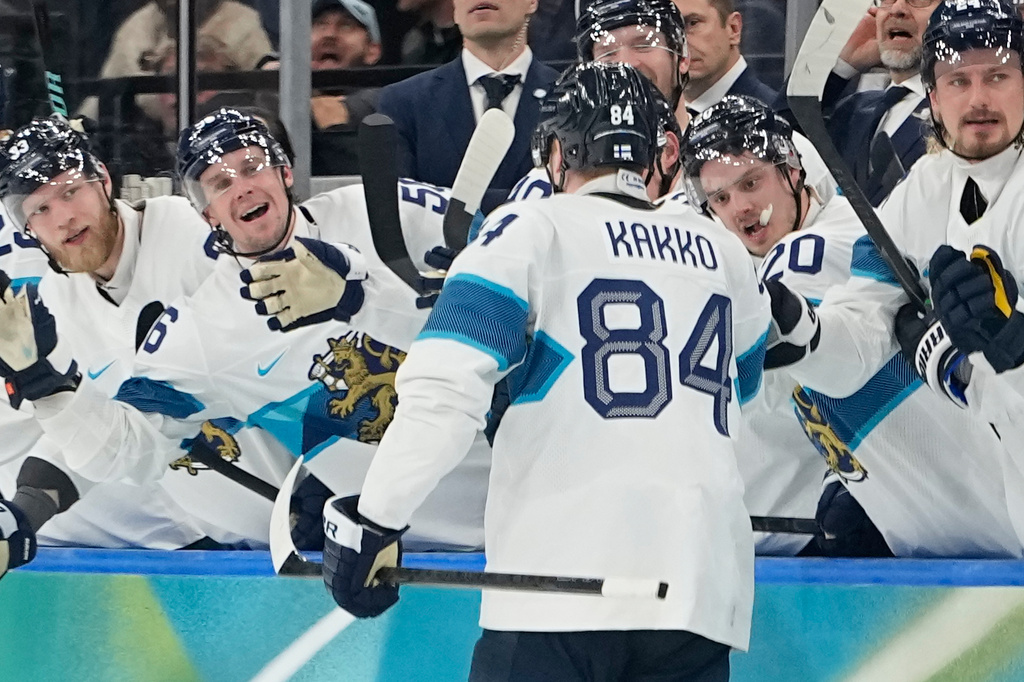 Finland's Kaapo Kakko (84) celebrates after scoring his side's fourth goal during a men's ice hockey bronze medal game between Slovakia and Finland at the 2026 Winter Olympics, in Milan, Italy, Saturday, Feb. 21, 2026. (AP Photo/Hassan Ammar)