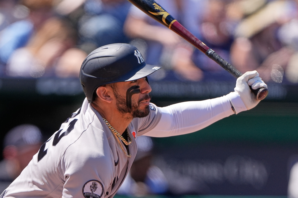 New York Yankees' Jose Caballero watches his RBI single during the second inning of baseball game against the Kansas City Royals, Monday, May 25, 2026, in Kansas City, Mo. (AP Photo/Charlie Riedel)