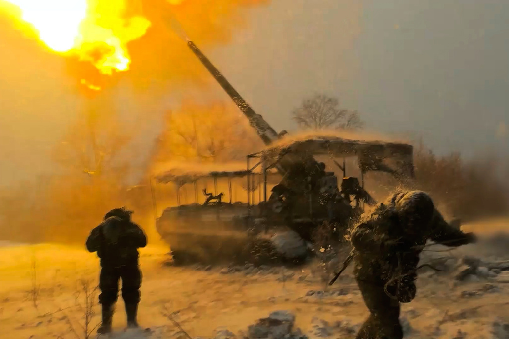 FILE - In this image made from video provided by Russian Defense Ministry Press Service on Jan. 13, 2026, Russian soldiers in Ukraine fire toward Ukrainian positions. (Russian Defense Ministry Press Service via AP, File)
