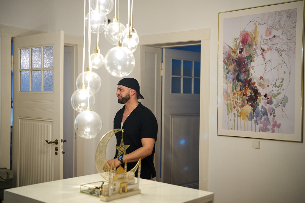 Gay Muslim influencer Ali Darwich, hosts an inclusive Iftar, the Ramadan fast-breaking meal, with friends who are Muslim, Christian, queer and straight, in Berlin, Germany, Wednesday, March 11, 2026. (AP Photo/Ebrahim Noroozi)