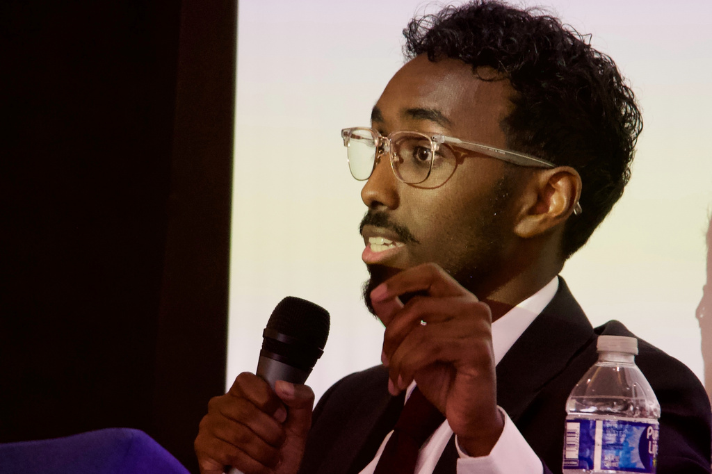 FILE - Liban Mohamed, the son of Somali immigrants and a former Meta and TikTok employee, speaks on a panel of candidates running to represent Utah's new Democratic-leaning congressional district, March 21, 2026, in Taylorsville, Utah. (AP Photo/Hannah Schoenbaum, File)