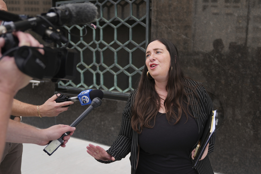 Sara Garber, attorney for Chengxuan Han, one of two Chinese scientists accused of smuggling or shipping biological material to the United States, speaks after a sentencing hearing at the U.S. District Court, Wednesday, Sept. 10, 2025, in Detroit. (AP Photo/Ryan Sun)