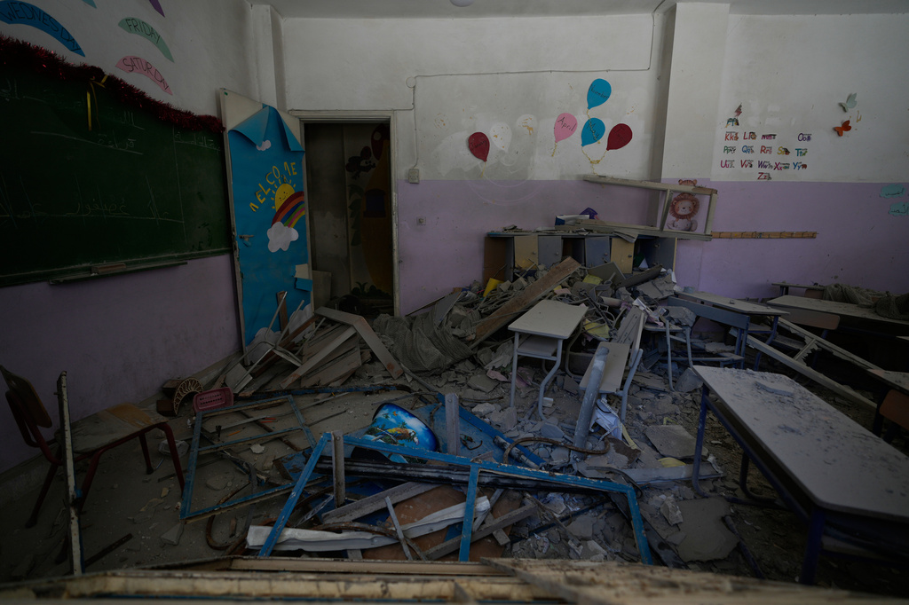 A classroom at a school is in ruins after it was hit days ago by an Israeli airstrike in the southern port city of Tyre, Lebanon, Thursday, April 30, 2026. (AP Photo/Hussein Malla)